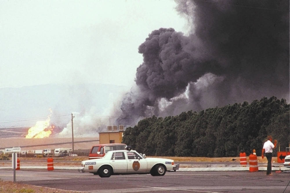 Smoke rising from the former PEPCON plant site after a series of fires and explosions at the facility on May 4, 1988.