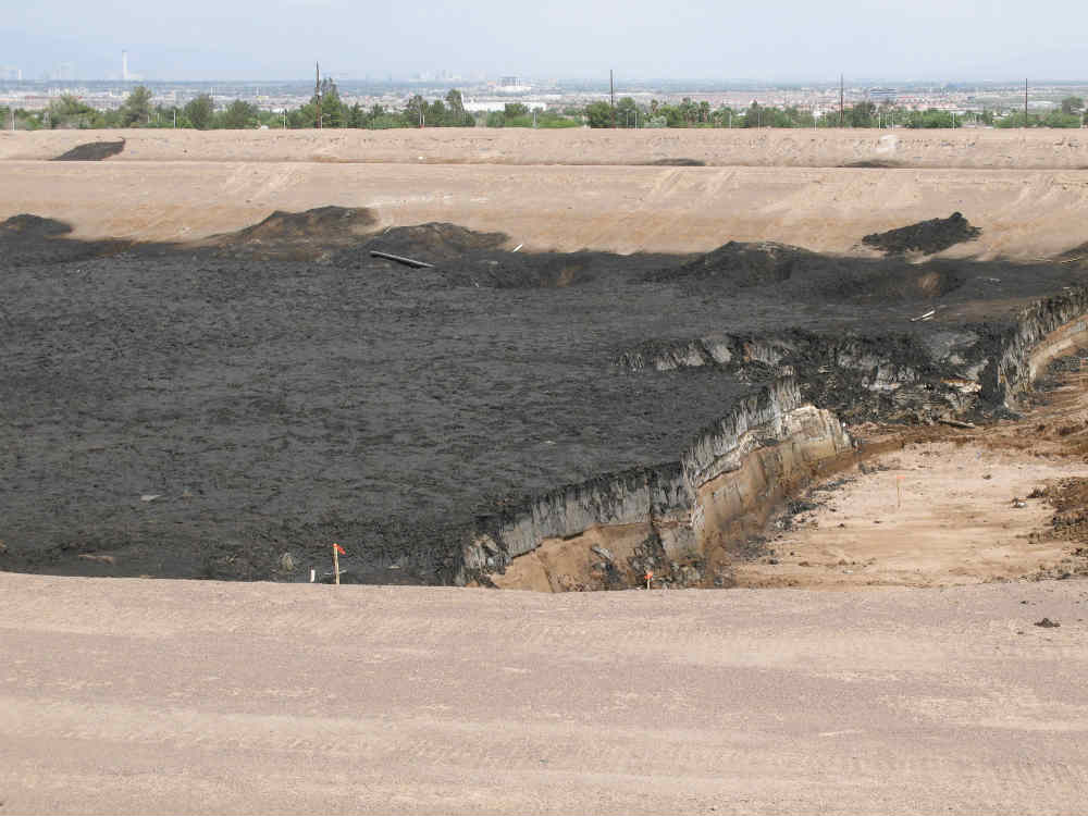 2007 - Layering of disposal pond and underlying soil exposed during excavation activities to remediate a typical evaporation pond.