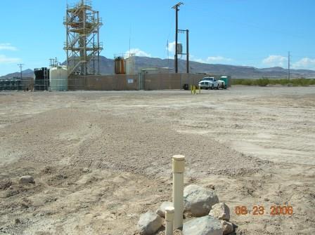 2006-08-23 Groundwater Treatment System.  Monitoring well in foreground, treatment system in background.