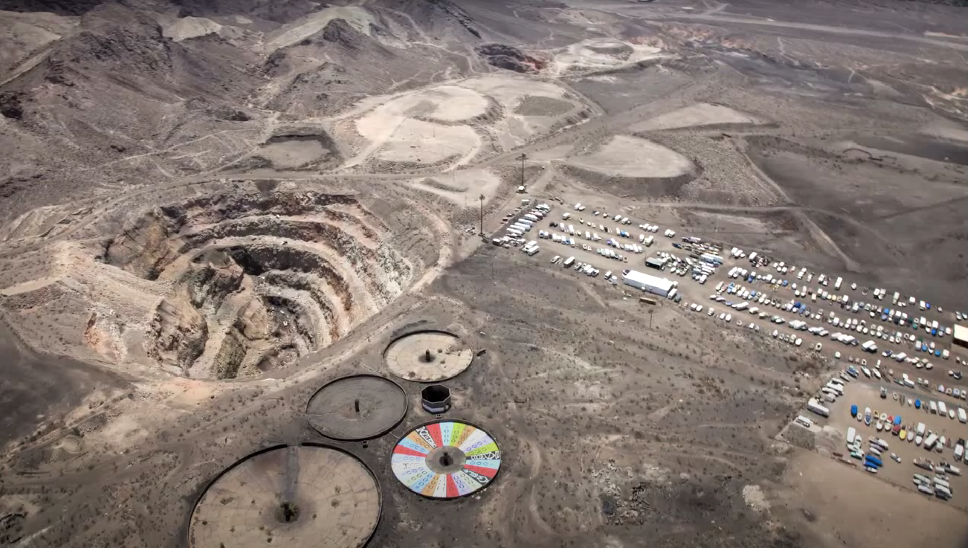 The Hydro pit, Hulin pit, three tailings ponds, overburden, flotation tank foundations, and a portion of the ore yard are visible in this aerial photograph of the Three Kids Mine site. as well as the nearby Lake Mead Boat Storage and Laker Plaza businesses.